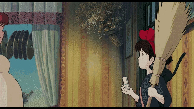a girl with a red bow on her head is holding a broom in front of a window