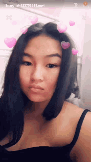 a girl with hearts in her hair is on a snapchat