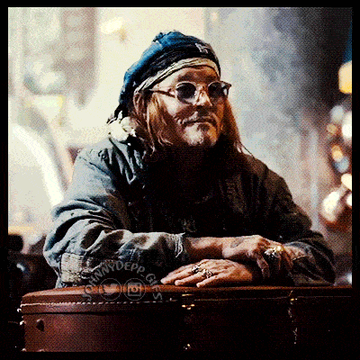 a man wearing sunglasses and a bandana with the name johnny depp on the bottom right