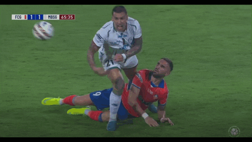 a soccer player with the number 21 on his jersey is kicking another player