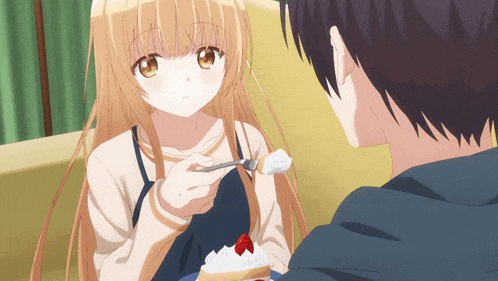 a girl is feeding a man a piece of cake with whipped cream on it