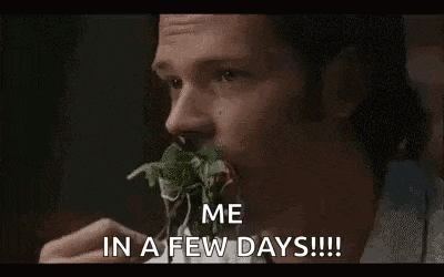 a man is eating a piece of lettuce with a knife and fork .