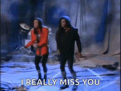 a couple of people dancing on a stage with the words i really miss you written on the bottom .