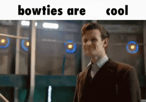a man in a suit is smiling with the words " bowties are cool " above him