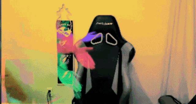 a black gaming chair with a pair of glasses on the back of it
