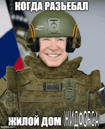 a man wearing a helmet and a bullet proof vest with russian writing