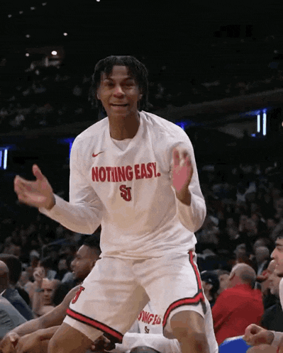 a man wearing a shirt that says nothing easy on it
