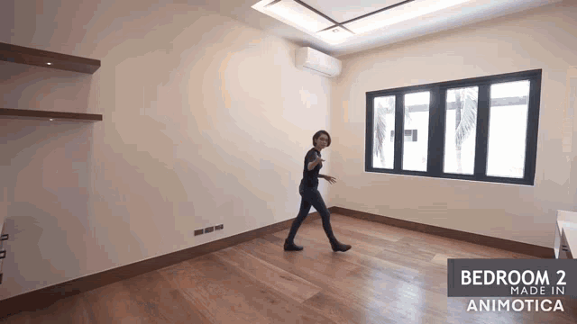 a woman walks through an empty bedroom with the words bedroom 2 made in animotica