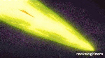 a yellow light is coming out of a dark background