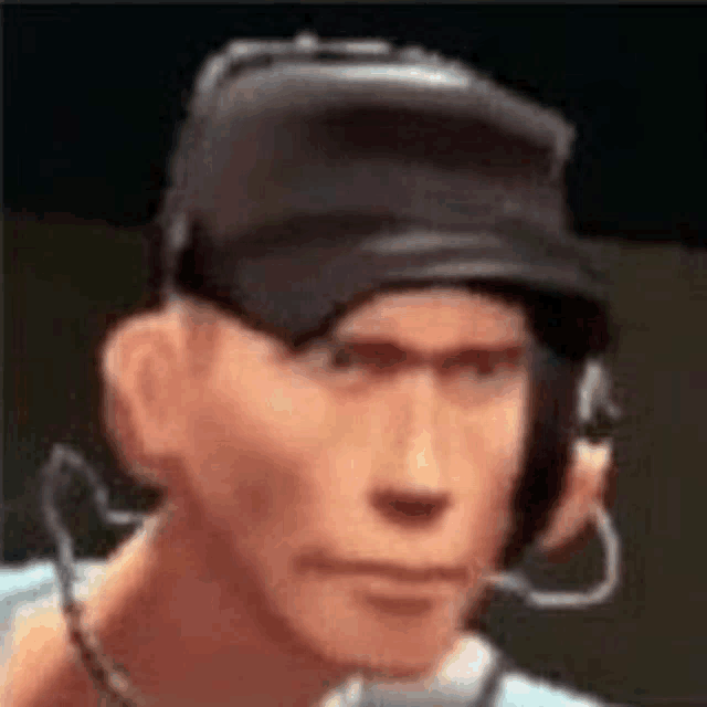 a man wearing headphones and a hat is looking at the camera .