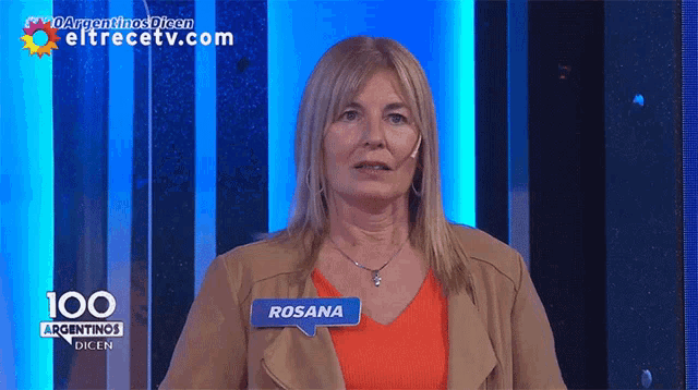 a woman wearing a name tag that says rosana on it