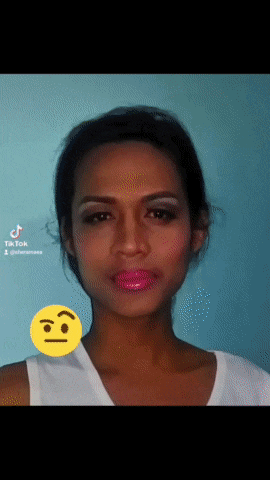 a woman 's face with a smiley face next to it that says tiktok