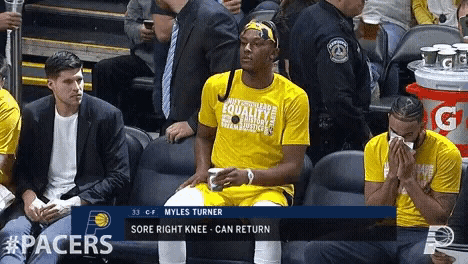 a player named myles turner sits in the stands