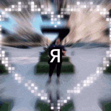 a blurry picture of a person with the letter a on their shirt