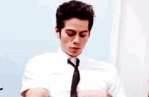 a man in a white shirt and black tie