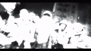 a black and white image of a group of people with a question mark