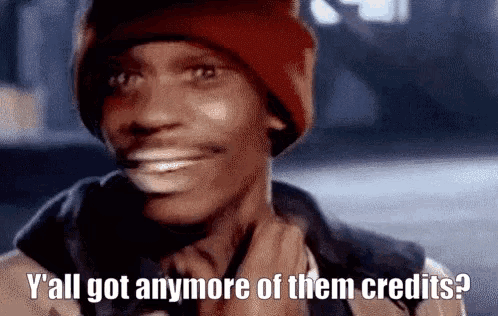 a man wearing a red hat is smiling and asking if he 's got anymore of their credits .