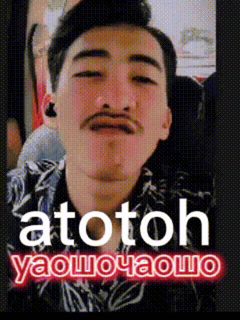 a picture of a man with a mustache and the words " atotoh yaouoyaouo " above him