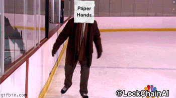 a man with a piece of paper on his head that says paper hands on it