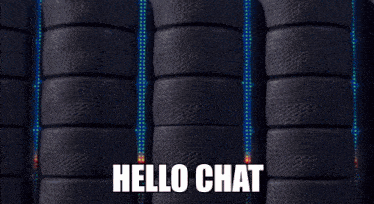 a red lightning mcqueen car is surrounded by tires and says hello chat on the bottom