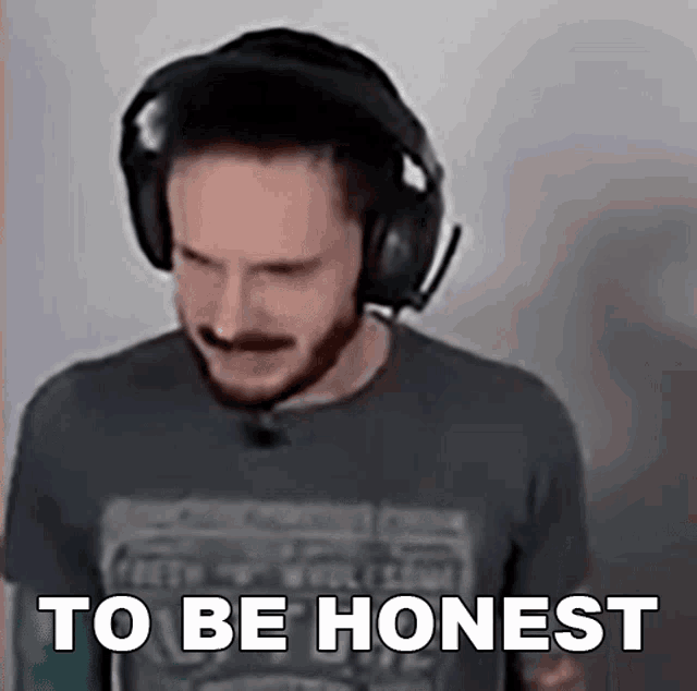 a man wearing headphones and a shirt that says to be honest on it