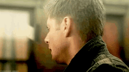 a close up of a man 's head with a blurry background .