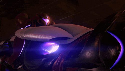 a person riding a futuristic motorcycle with a purple light around the wheel