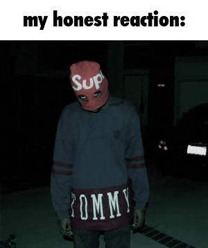 a man wearing a supreme mask and a tommy hilfiger sweatshirt is standing in a parking lot .