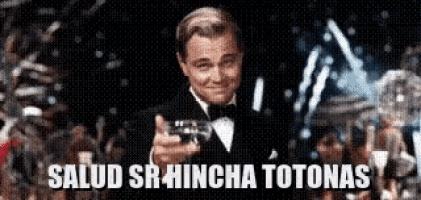a man in a tuxedo is holding a gun and says salud sr hincha totonas on the bottom