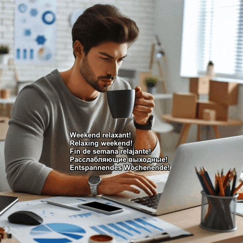 a man sits at a desk with a laptop and a cup of coffee