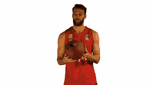 a basketball player with the number 22 on his jersey is holding a basketball