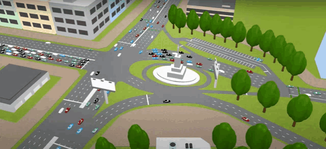 an aerial view of a busy intersection with a statue in the middle of it