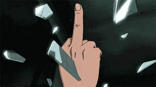a hand is holding a piece of broken glass and giving the middle finger