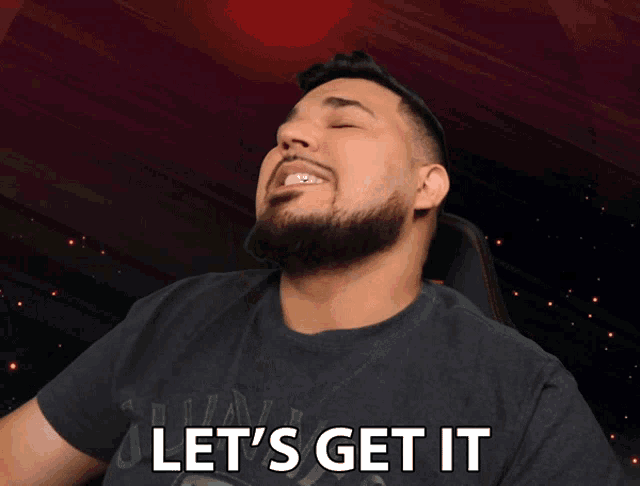 a man with a beard is making a face and says let 's get it