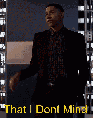 a man in a suit is dancing with the words that i dont mind below him