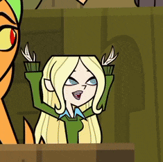 a cartoon character with blonde hair and blue eyes is sitting in front of a green wall
