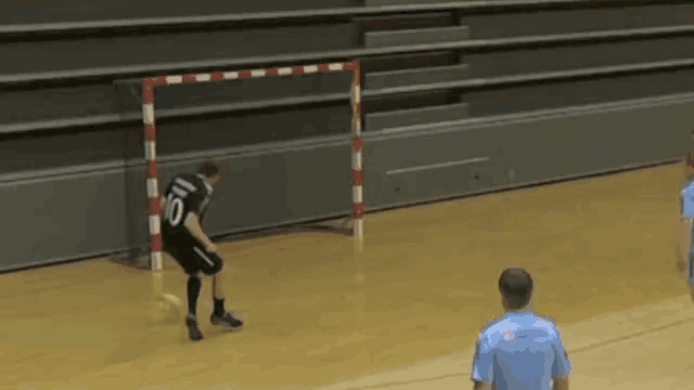 a soccer player wearing a number 10 jersey kicks the ball