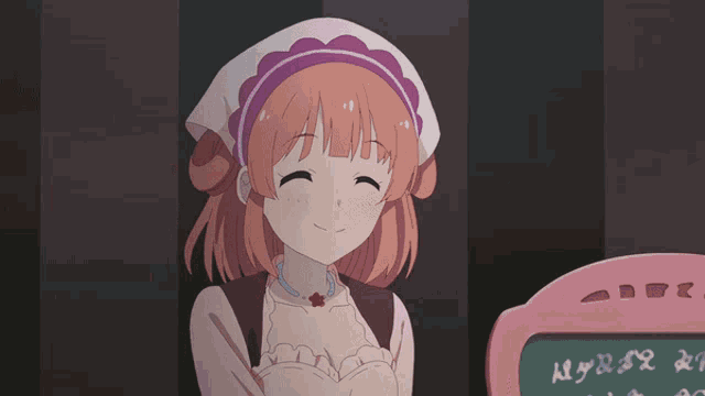 a girl in a maid outfit is smiling in front of a chalkboard with the letters a and b on it