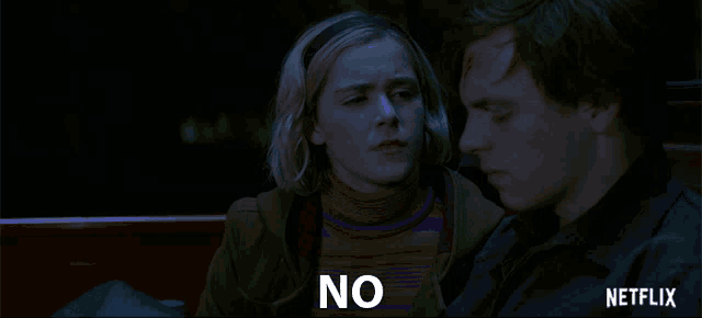 a man and a woman are sitting next to each other and the word no is on the bottom