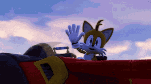 tails from sonic the hedgehog is waving from the back of a red vehicle