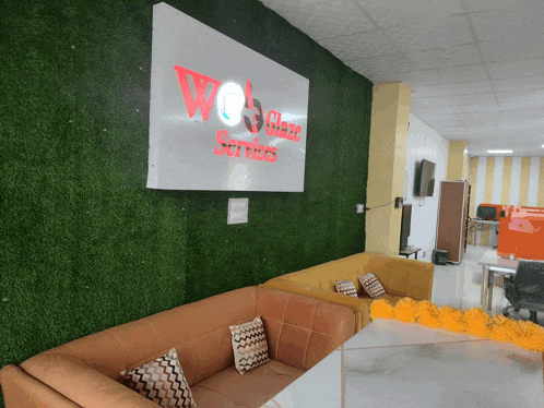 a waiting room with a couch and a sign that says we have services