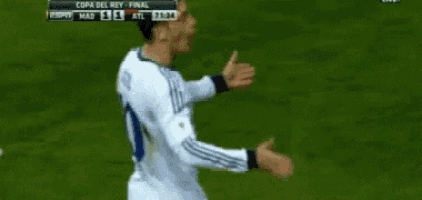 a soccer player is celebrating a goal during a match between madrid and atl