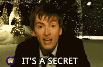 a man in a suit and tie is saying it 's a secret
