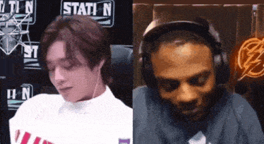 a man and a woman are sitting next to each other in front of a sign that says station n.