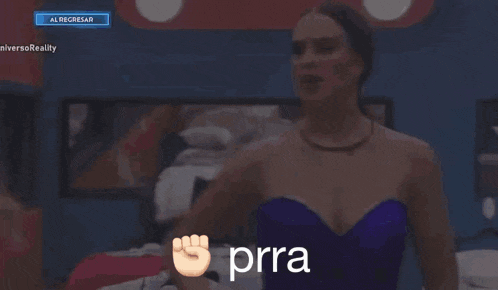 a woman in a purple dress is giving a fist bump and the word prra is on the screen