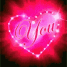 a pink heart with the words `` you '' written inside of it
