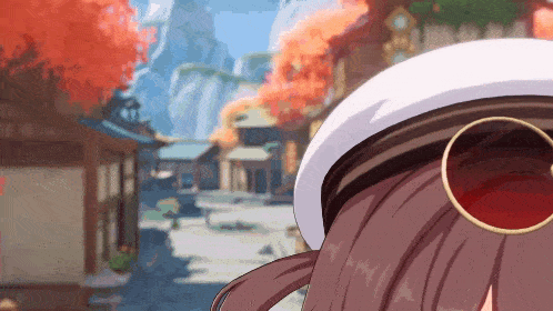 a girl wearing a white hat and sunglasses is standing in a town .