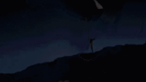 a cave with a light coming out of the bottom of it