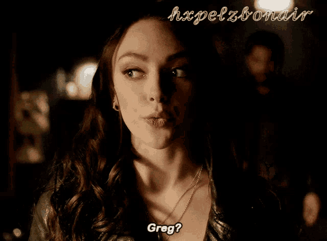 a close up of a woman 's face with the words greg written above her