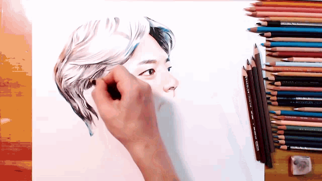 a drawing of a man 's face is being drawn by a person with colored pencils including prismacolor